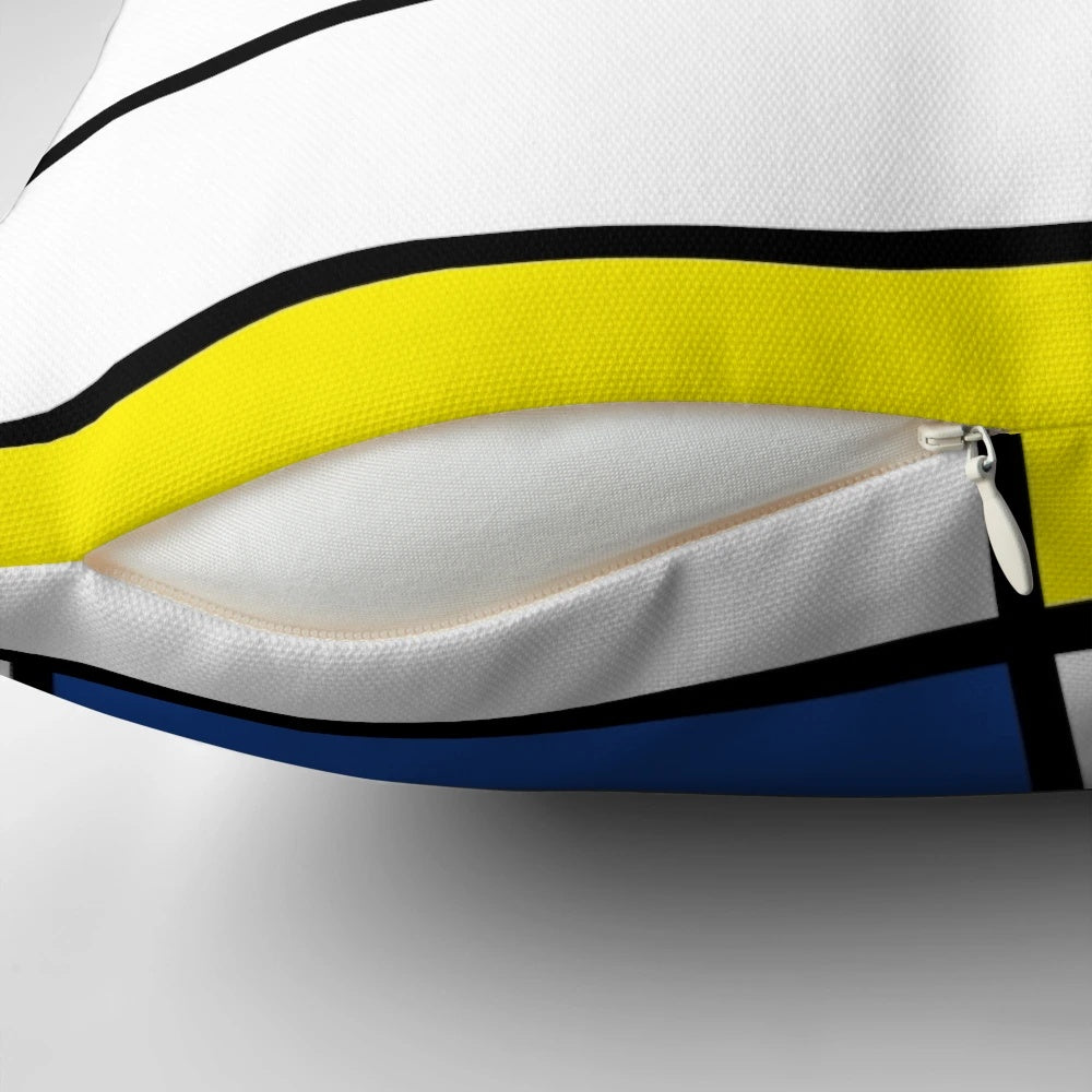 Minimalist Mondrian-inspired De Stijl modern art pillow featuring bold, colorful geometric block design.