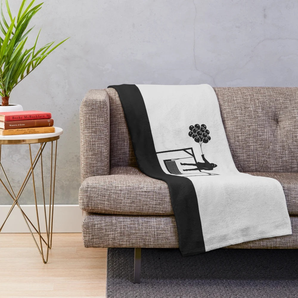Cozy black and white plush blanket with minimalist NF the Search design