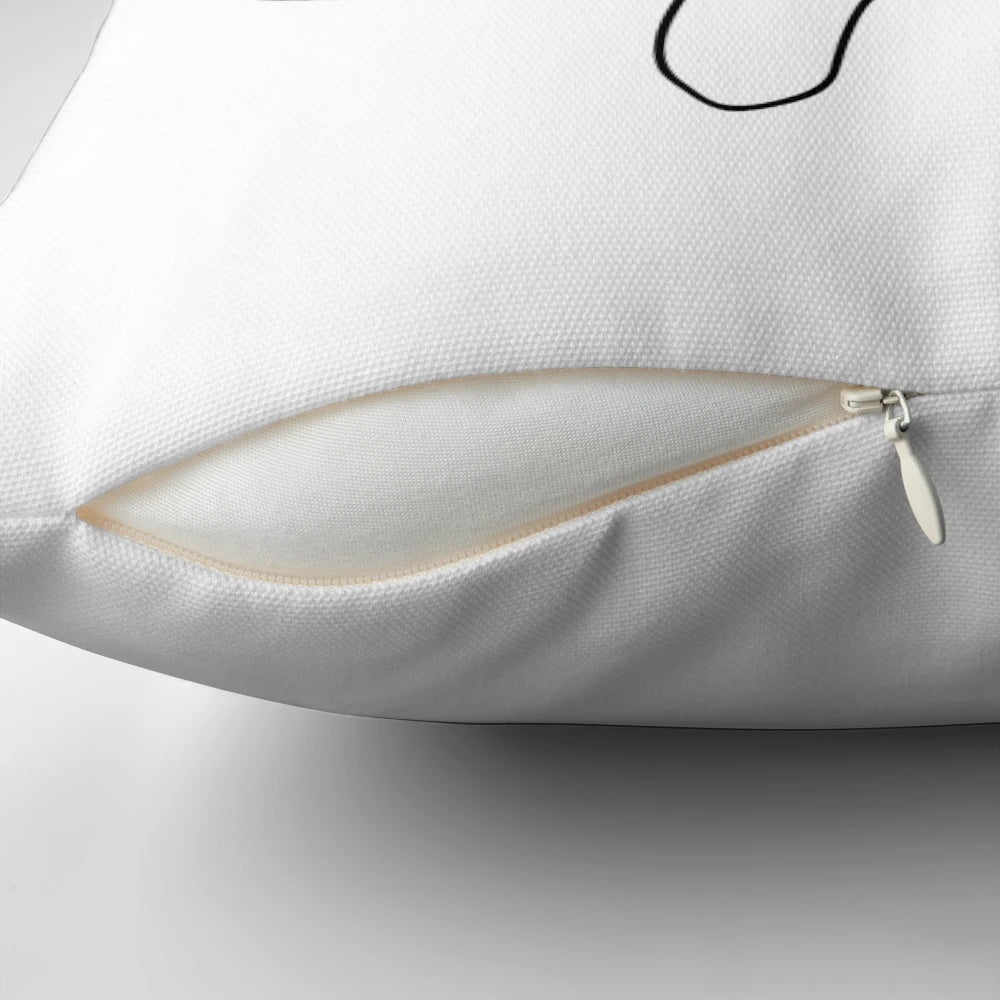 Minimalist abstract pillow with a continuous single line face design