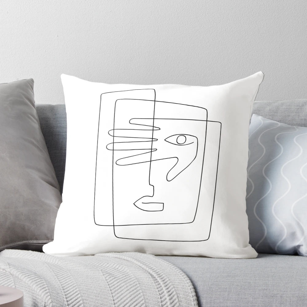 A square throw pillow featuring a simple, continuous line art design of a face.