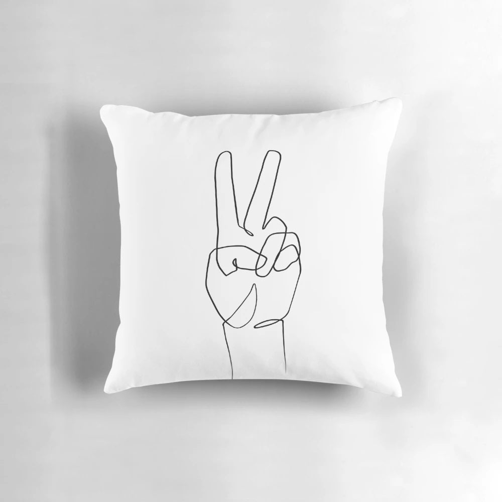 A minimalist one line art pillow featuring a simple peace sign hand design.