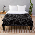 Minimalist platypus plush blanket in black and white line drawing design