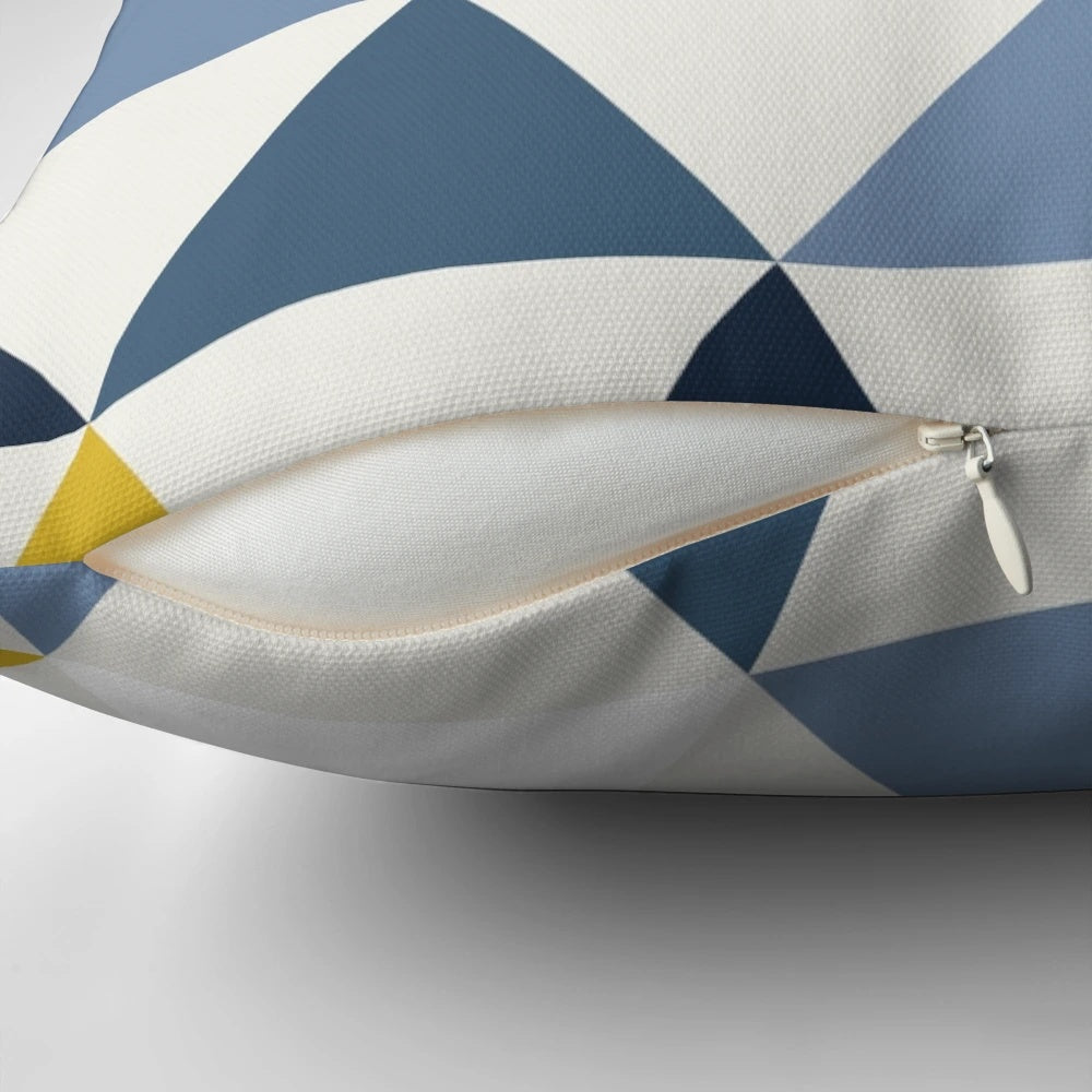 Scandinavian-inspired geometric pattern pillow in a modern, minimalist design featuring mustard, white, and blue colors.