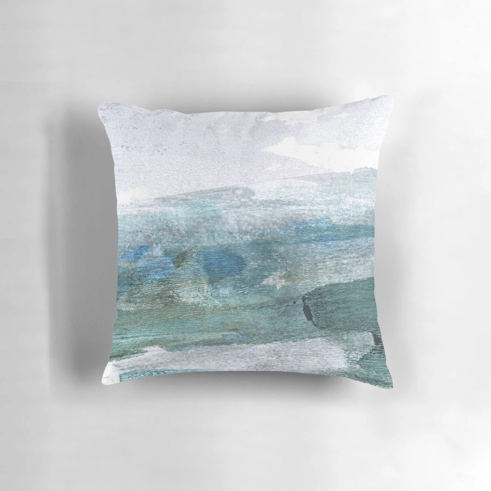 Minimalist abstract seascape watercolor painting on a throw pillow for coastal home decor