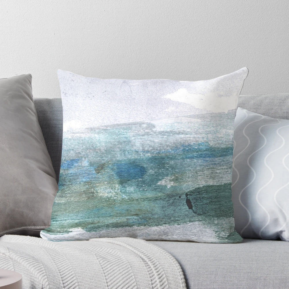 Minimalist abstract seascape watercolor painting on a throw pillow for coastal home decor