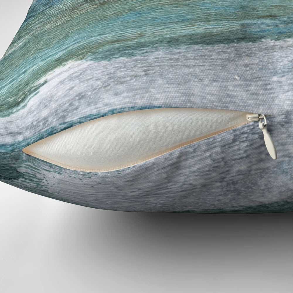Minimalist abstract seascape watercolor painting on a throw pillow for coastal home decor