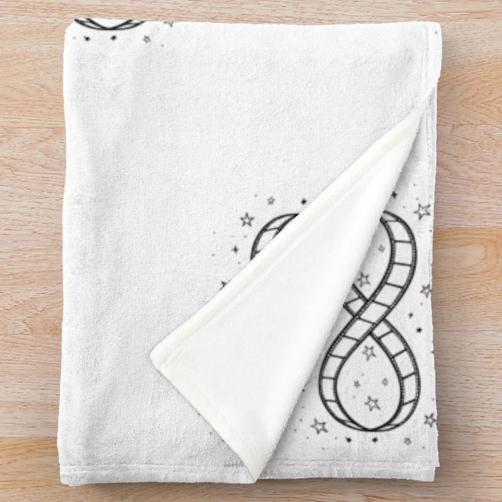 Plush blanket featuring a minimalist sketch illustration of an infinity symbol made from a movie film reel