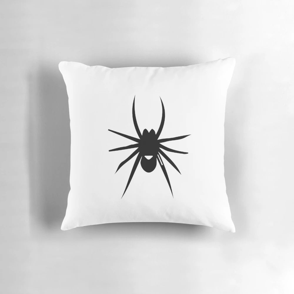 A stylish black and white spider silhouette pillow for modern home decor.