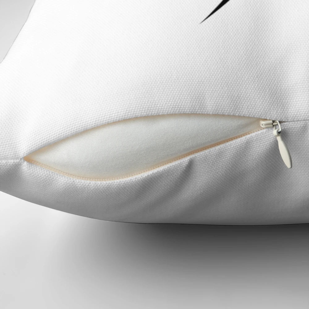 A stylish black and white spider silhouette pillow for modern home decor.
