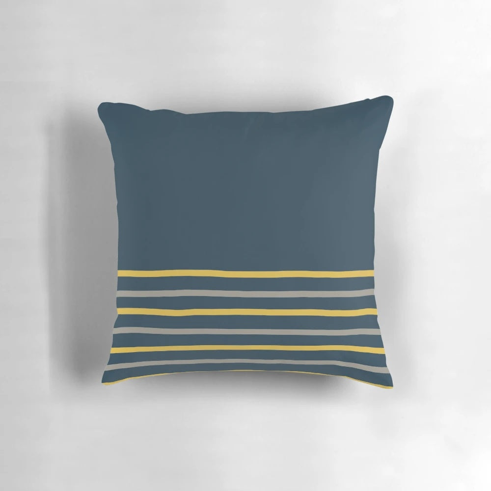 Minimalist striped pillow in a modern color block design featuring mustard yellow, grey, and navy blue tones.