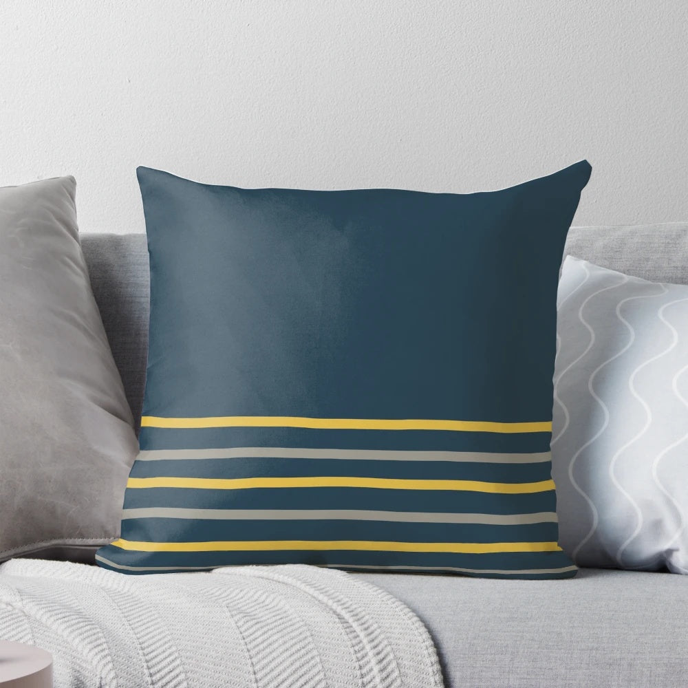 Minimalist striped pillow in a modern color block design featuring mustard yellow, grey, and navy blue tones.
