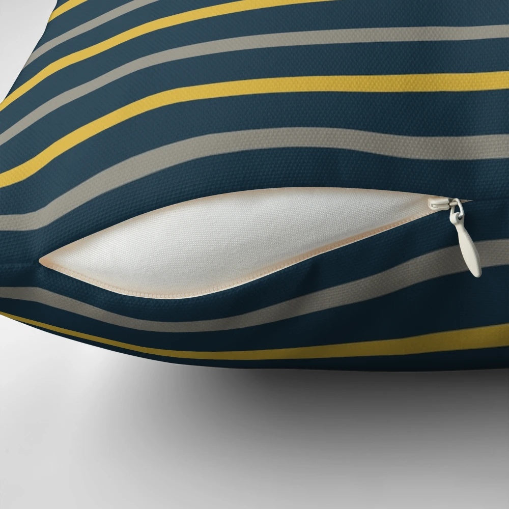 Minimalist striped pillow in a modern color block design featuring mustard yellow, grey, and navy blue tones.