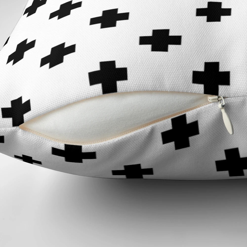 Black and white geometric Swiss cross pattern decorative pillow