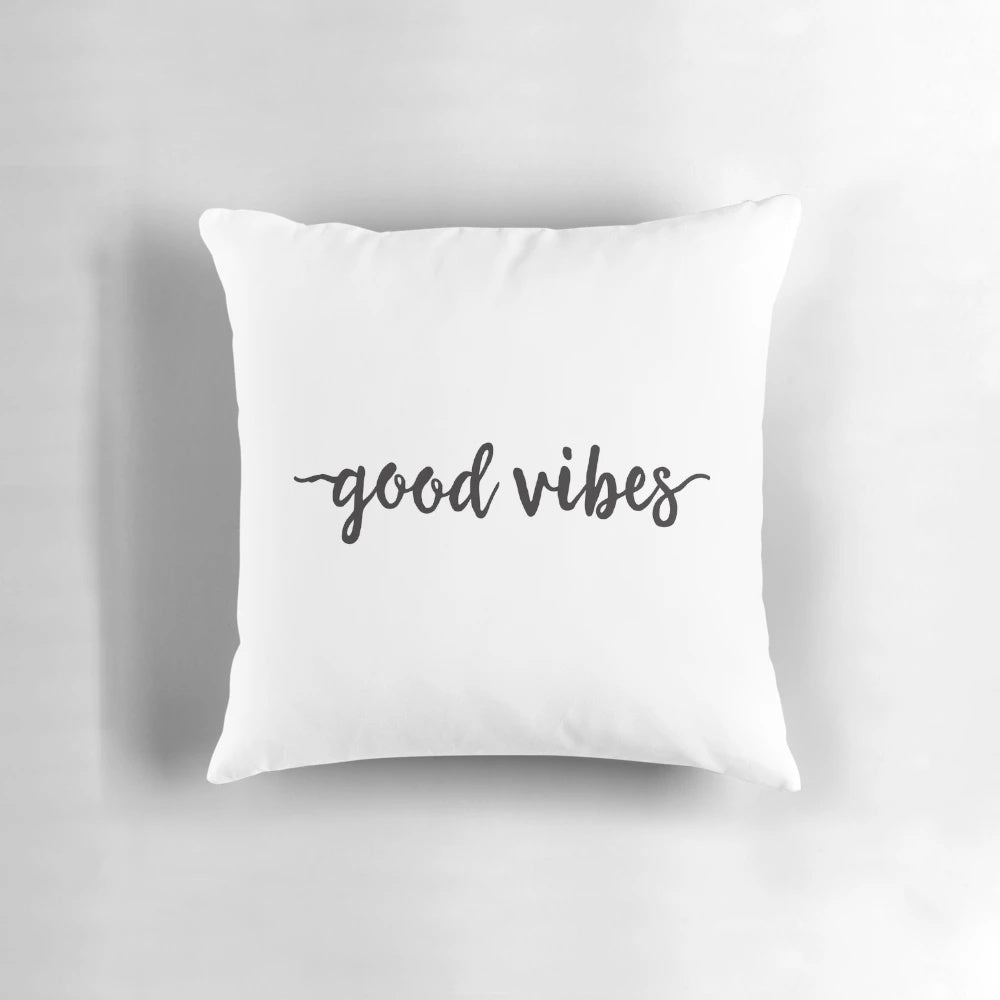 Black and white minimalist typography pillow with "Good Vibes" text