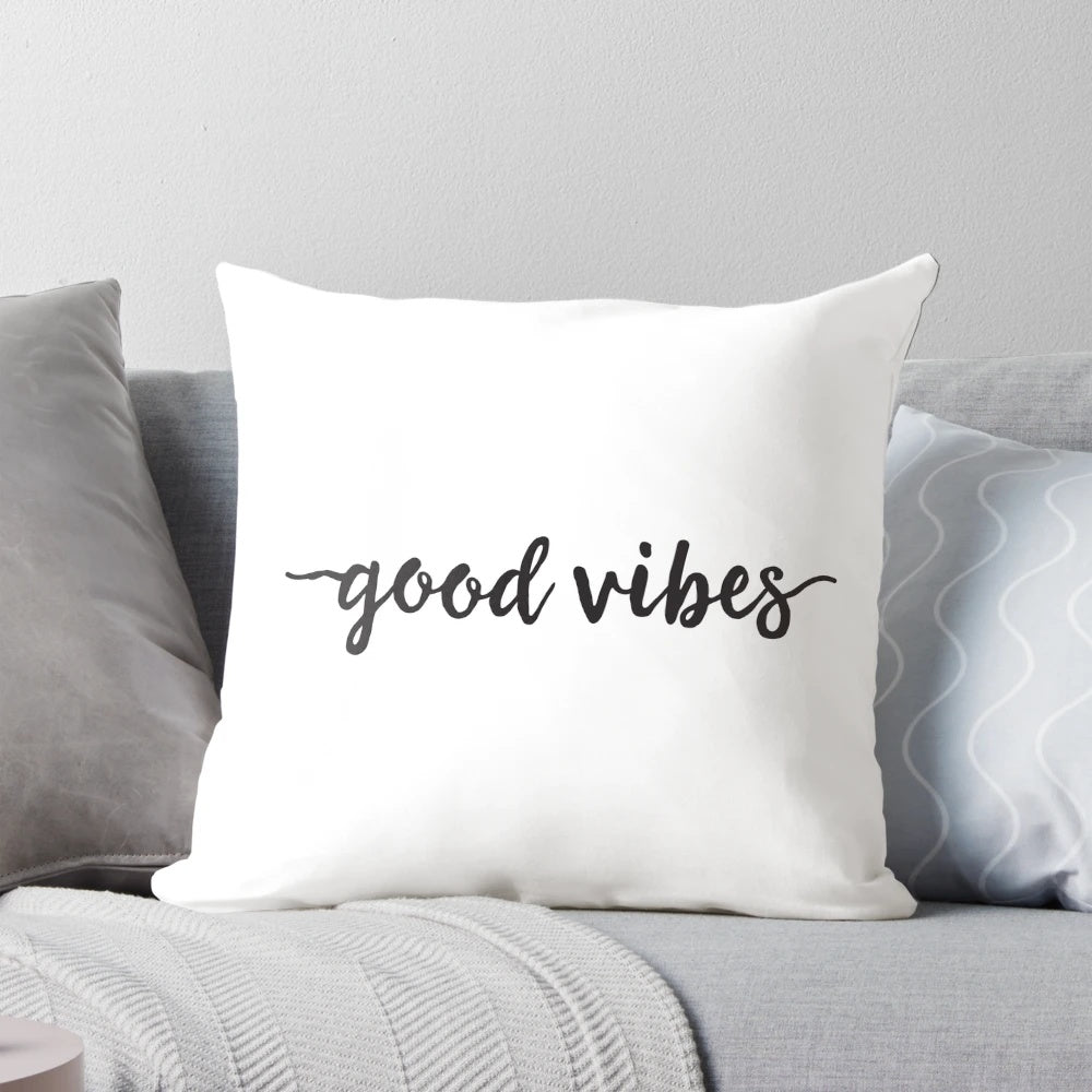Black and white minimalist typography pillow with "Good Vibes" text