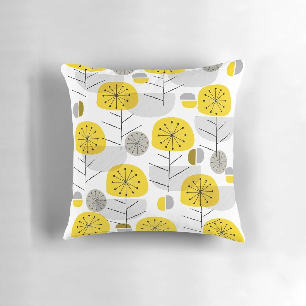 A decorative yellow pillow with a nature-inspired geometric pattern, perfect for Scandinavian-style modern interiors.