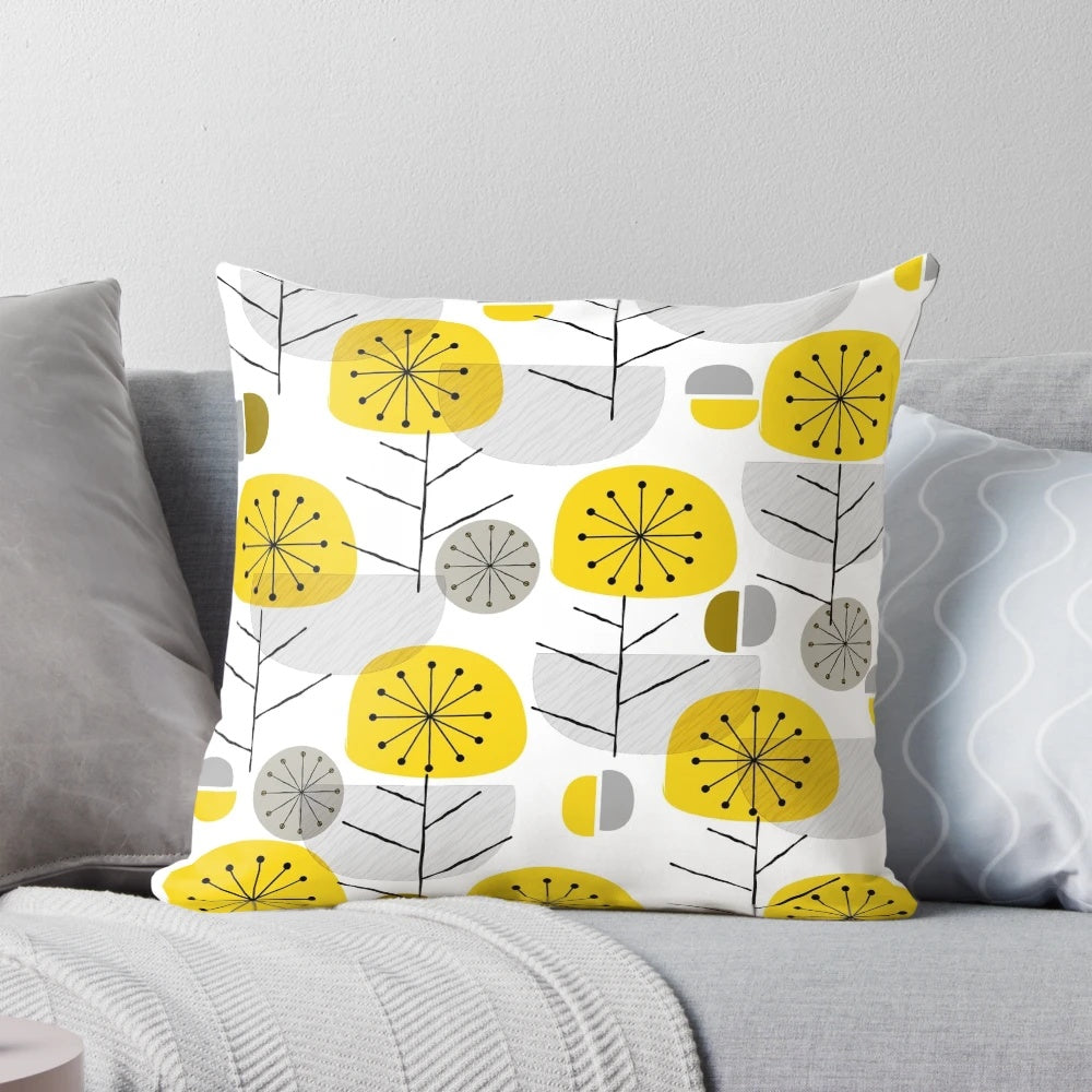 A decorative yellow pillow with a nature-inspired geometric pattern, perfect for Scandinavian-style modern interiors.