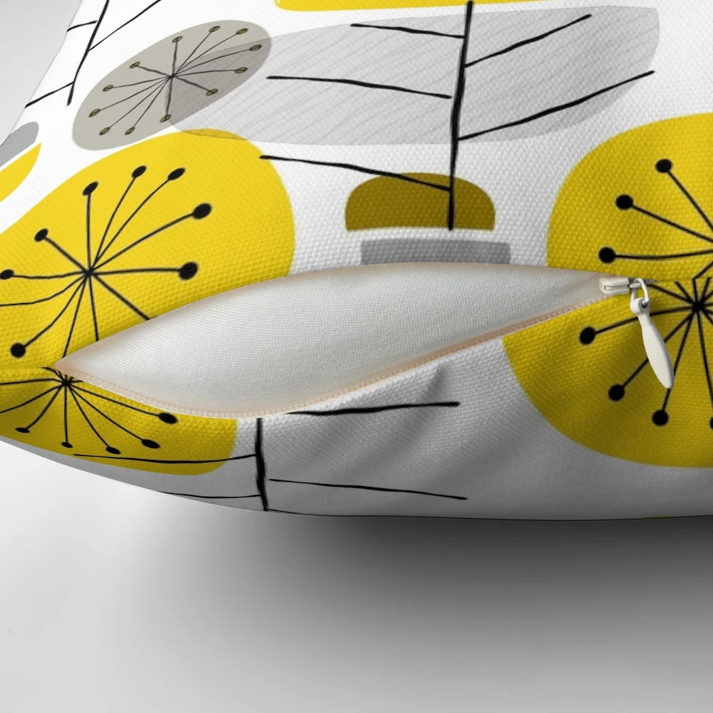 A decorative yellow pillow with a nature-inspired geometric pattern, perfect for Scandinavian-style modern interiors.