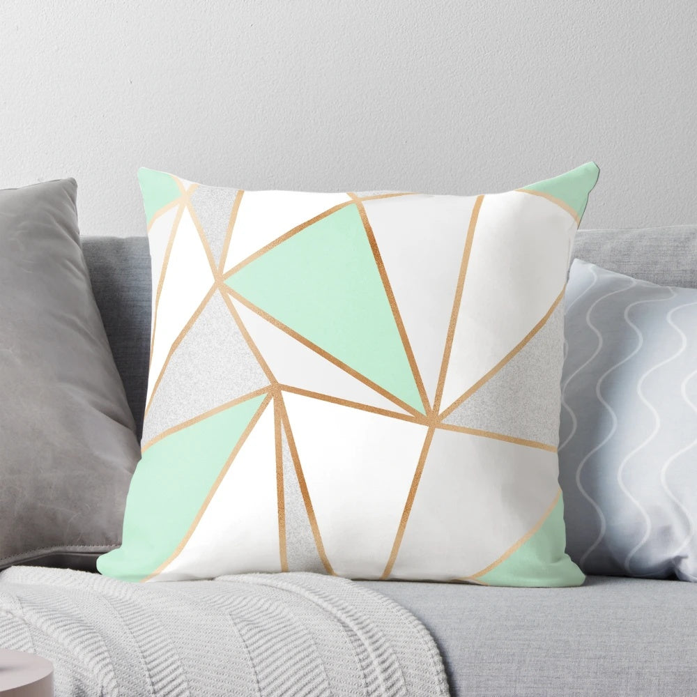 Mint green, grey, and gold geometric patterned decorative pillow for modern home accents
