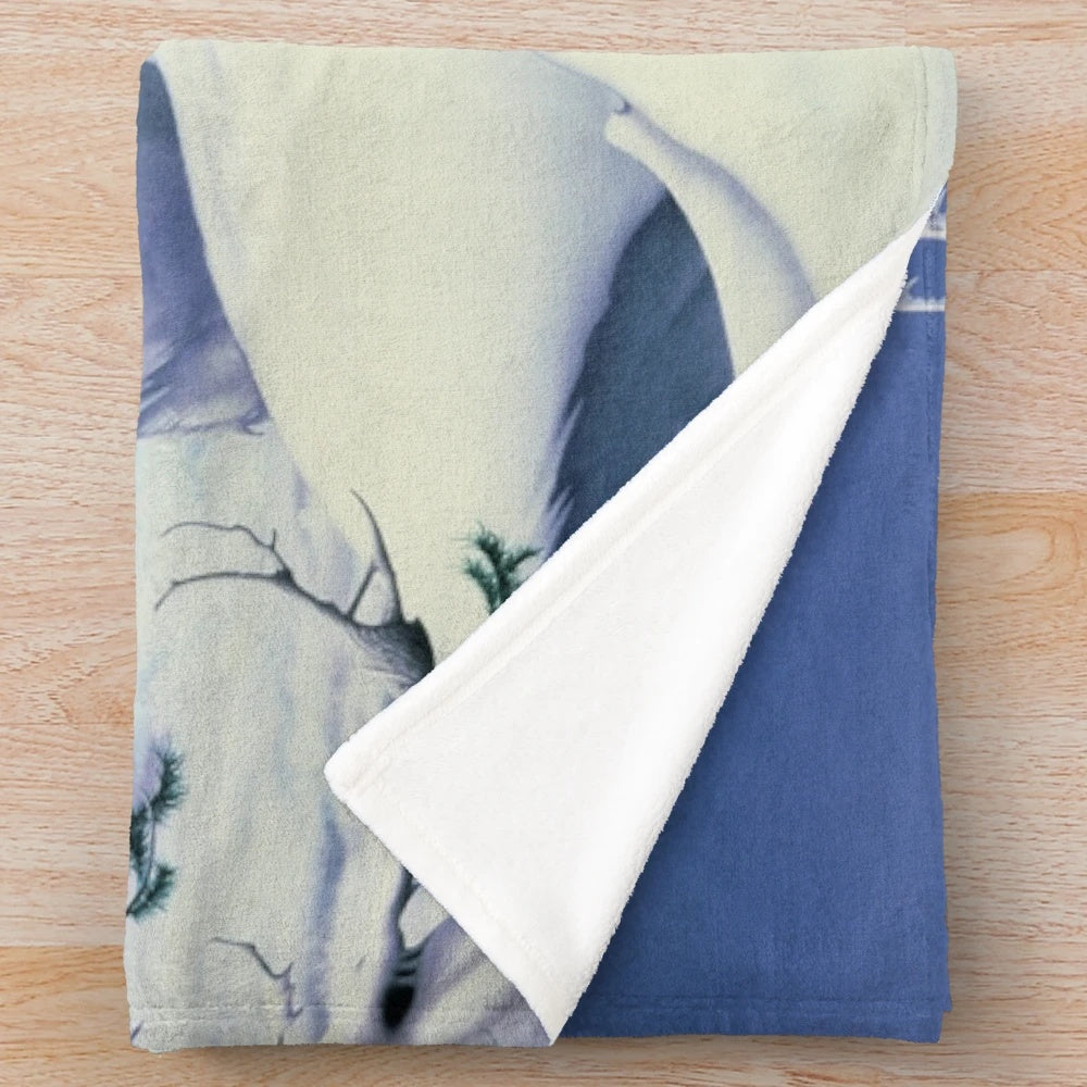Mirador plush blanket featuring a winter wonderland scene with elk and moose