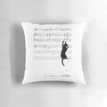 A pillow featuring a whimsical image of a mischievous cat playing with musical sheets and notes.
