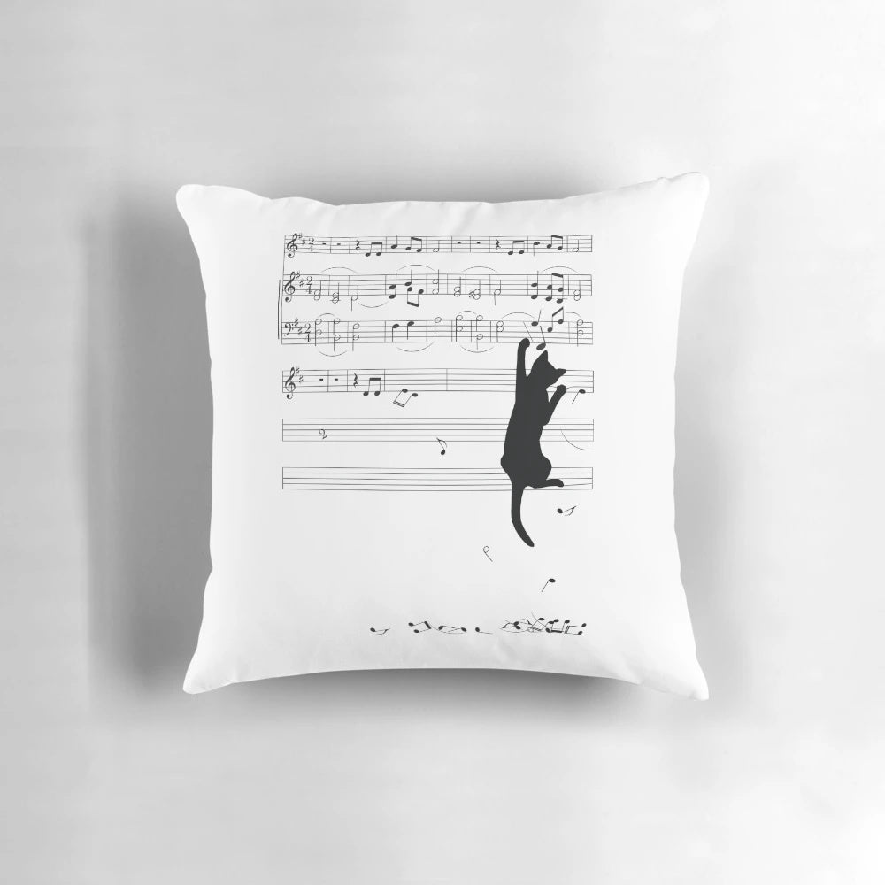A pillow featuring a whimsical image of a mischievous cat playing with musical sheets and notes.