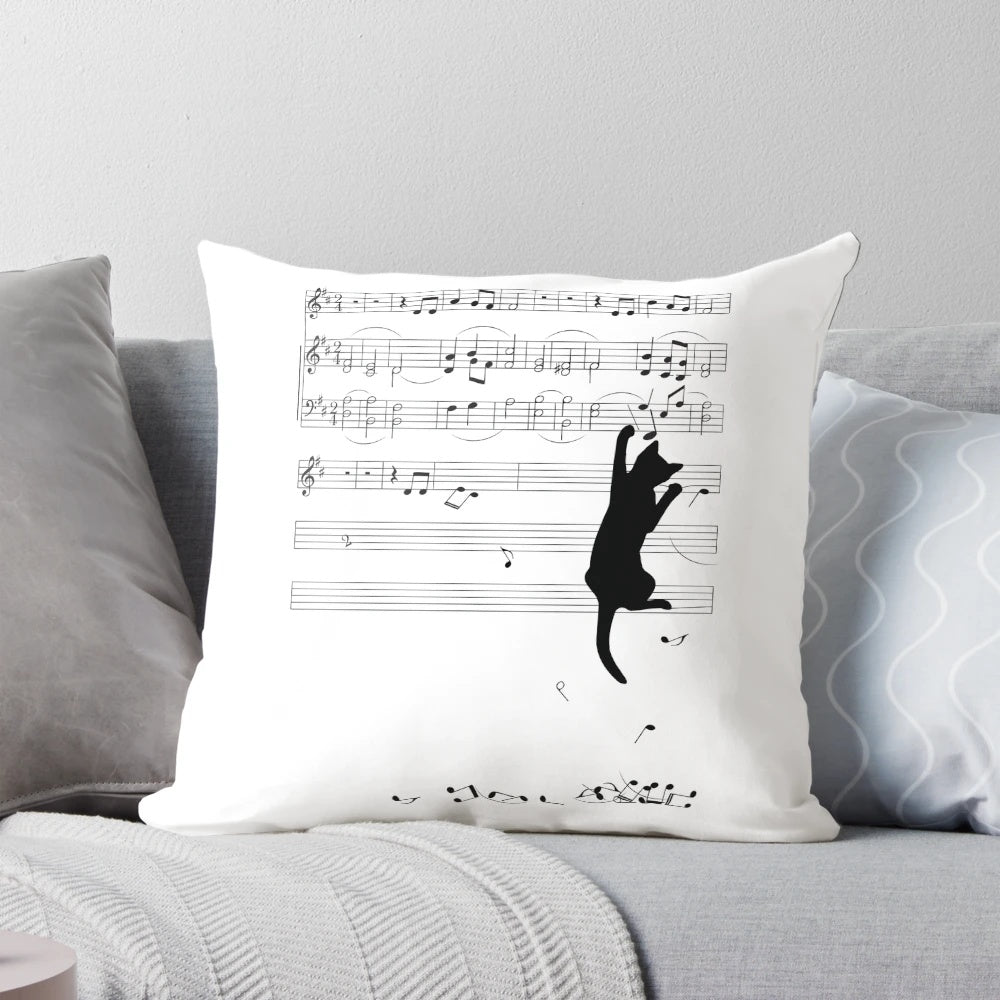 A pillow featuring a whimsical image of a mischievous cat playing with musical sheets and notes.
