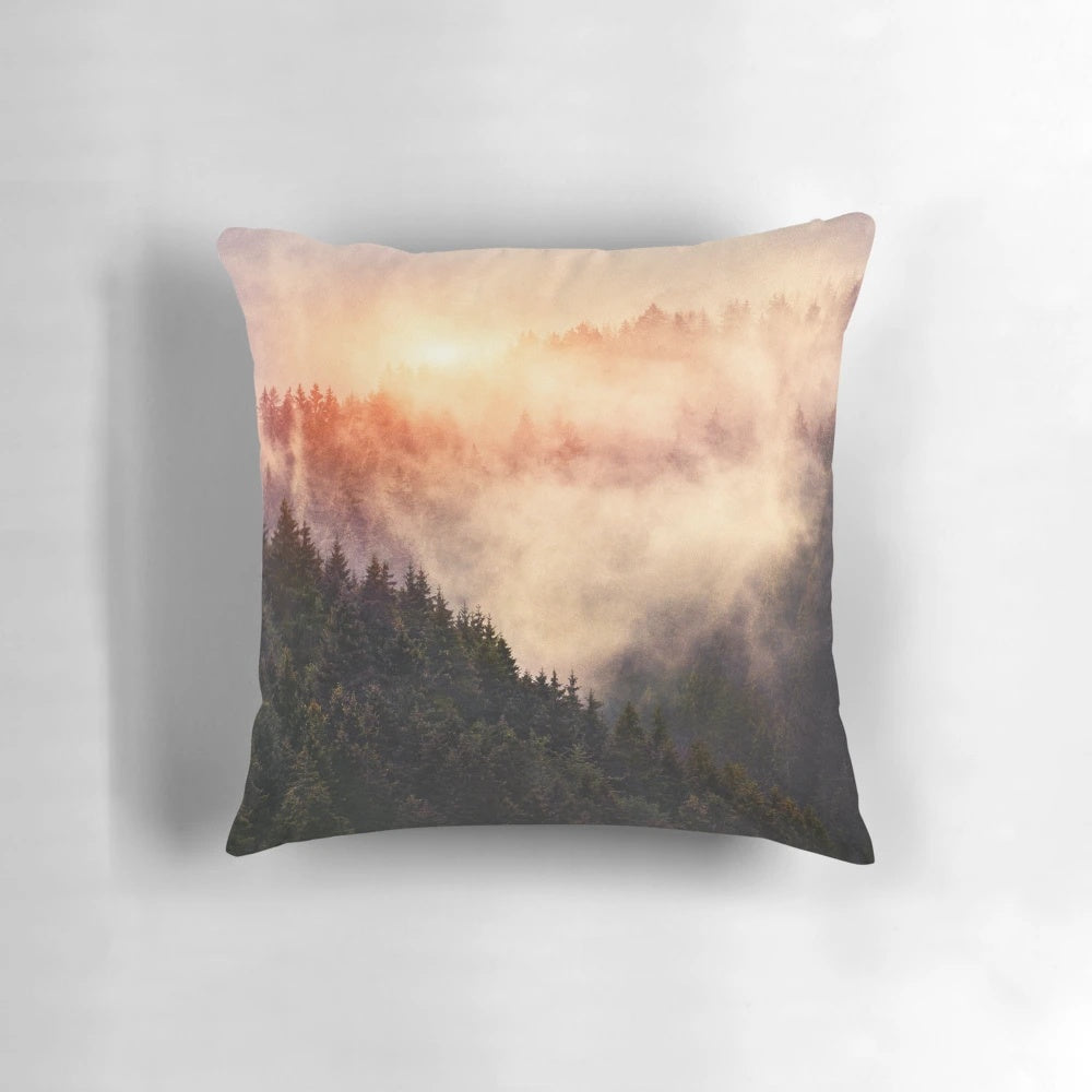 Pillow with a dreamy, misty foggy autumn forest scene featuring trees and mountains.