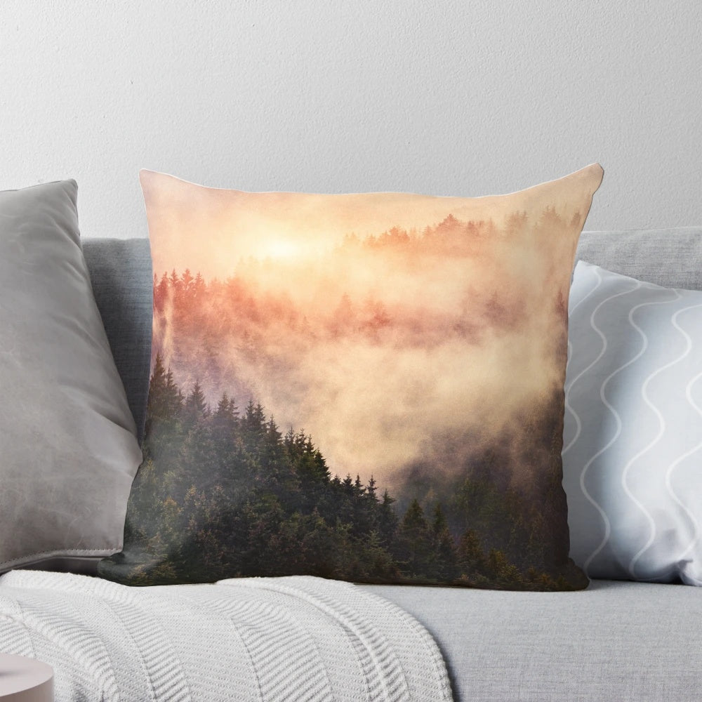 Pillow with a dreamy, misty foggy autumn forest scene featuring trees and mountains.