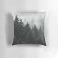 A cozy pillow featuring a misty, foggy fairytale forest scene with Cascadia trees covered in magical fog.