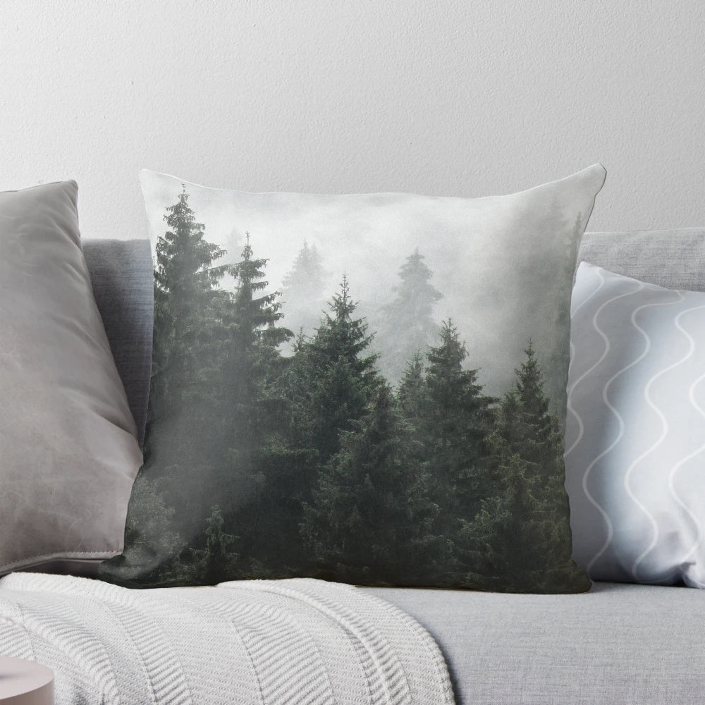 A cozy pillow featuring a misty, foggy fairytale forest scene with Cascadia trees covered in magical fog.