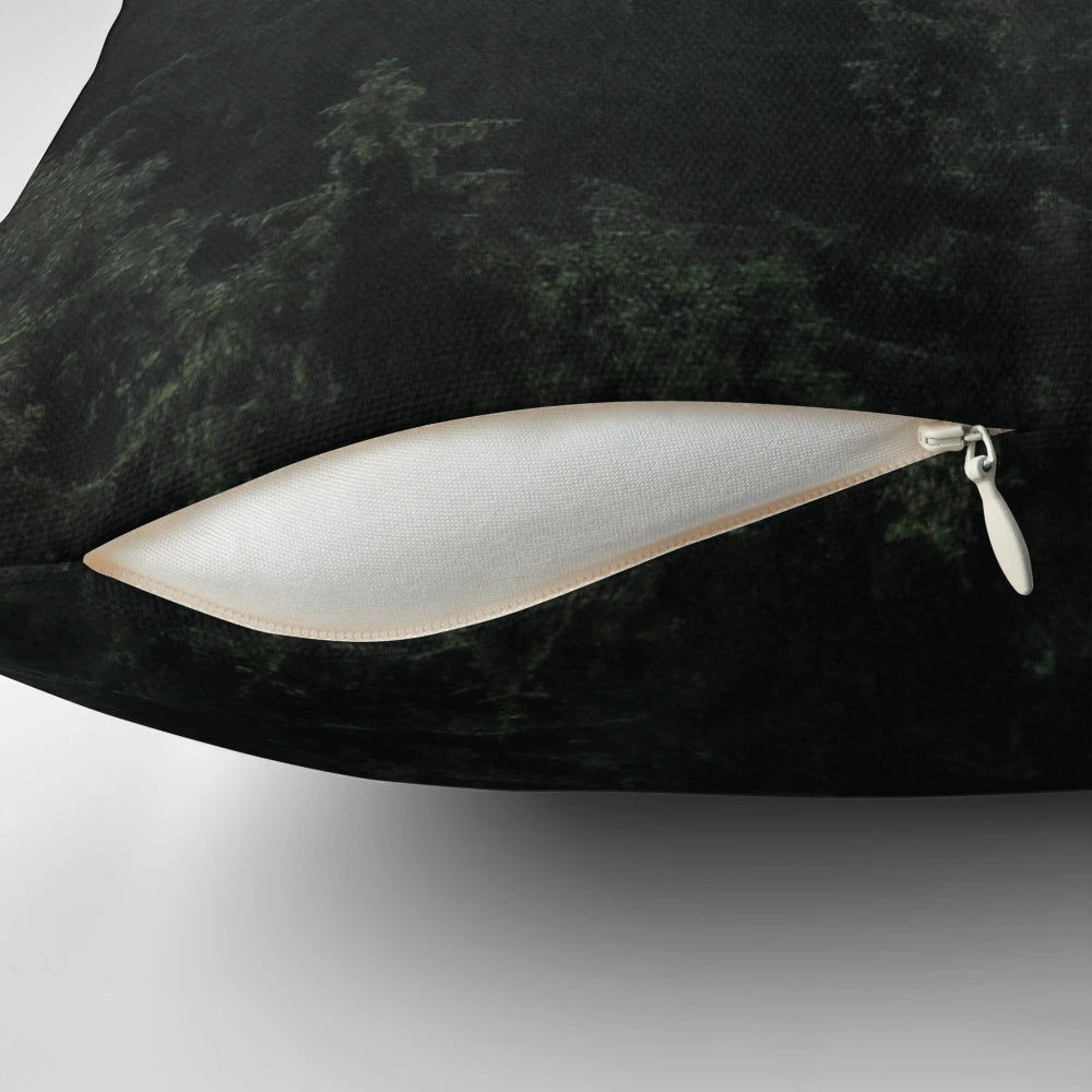 A cozy pillow featuring a misty, foggy fairytale forest scene with Cascadia trees covered in magical fog.