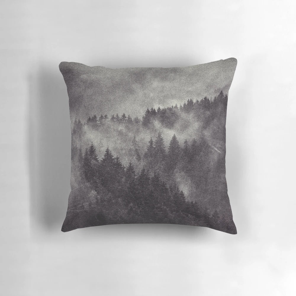 Pillow featuring a misty forest design with dark aesthetic nature shapes
