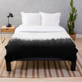 Plush blanket featuring a misty, romantic forest landscape with trees and cascading fog