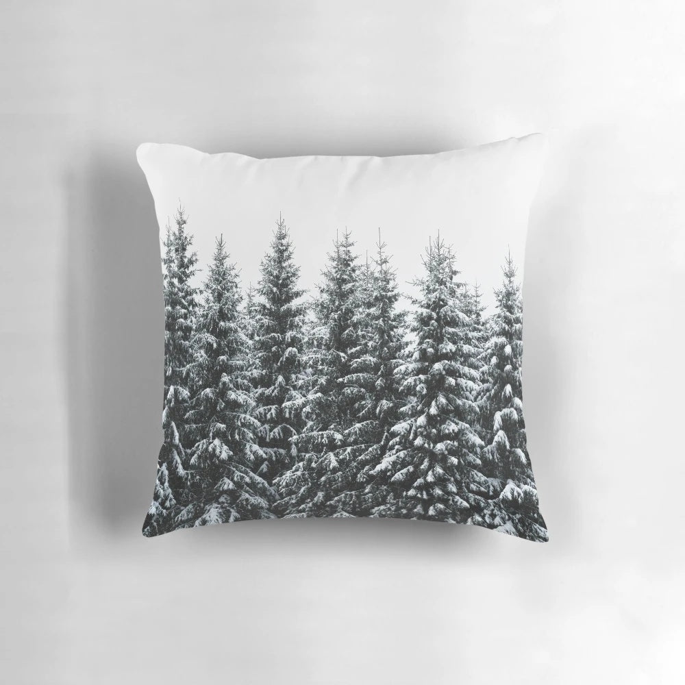 Cozy throw pillow featuring a dreamy, misty forest landscape with trees covered in fog