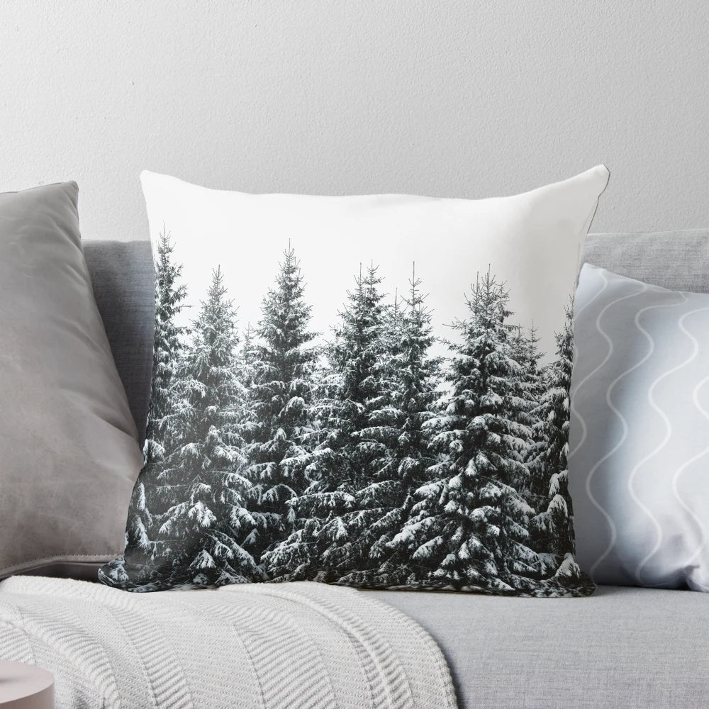 Cozy throw pillow featuring a dreamy, misty forest landscape with trees covered in fog