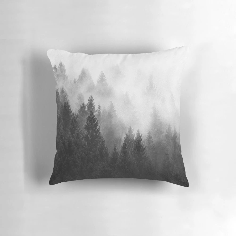 A cozy and misty forest pillow with trees covered in magical fog, perfect for fall adventures and fairytale-inspired décor.
