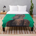 Cozy plush blanket featuring a design inspired by the iconic Moai statues of Easter Island