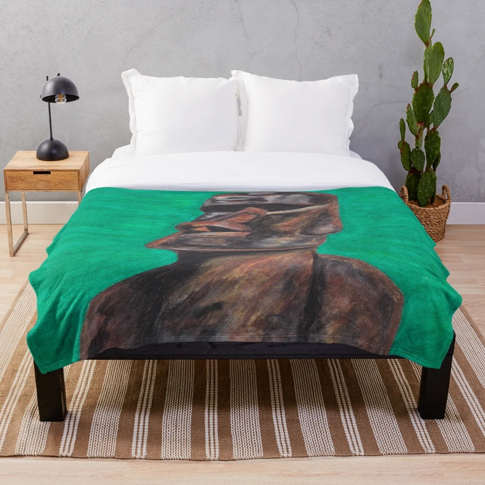 Cozy plush blanket featuring a design inspired by the iconic Moai statues of Easter Island