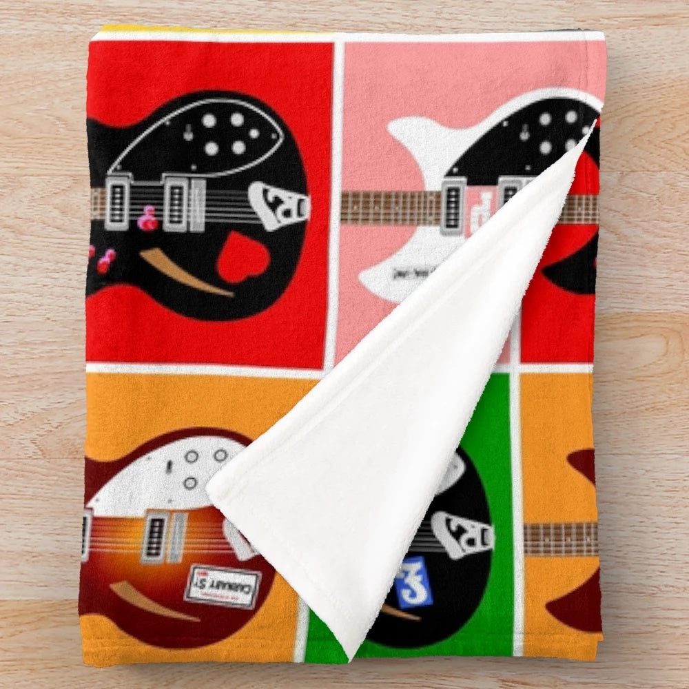 Plush blanket with pop art-style image of Paul Weller's Rickenbacker guitars from The Jam