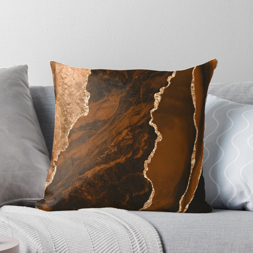 Modern abstract agate design decorative throw pillow in brown and gold colors
