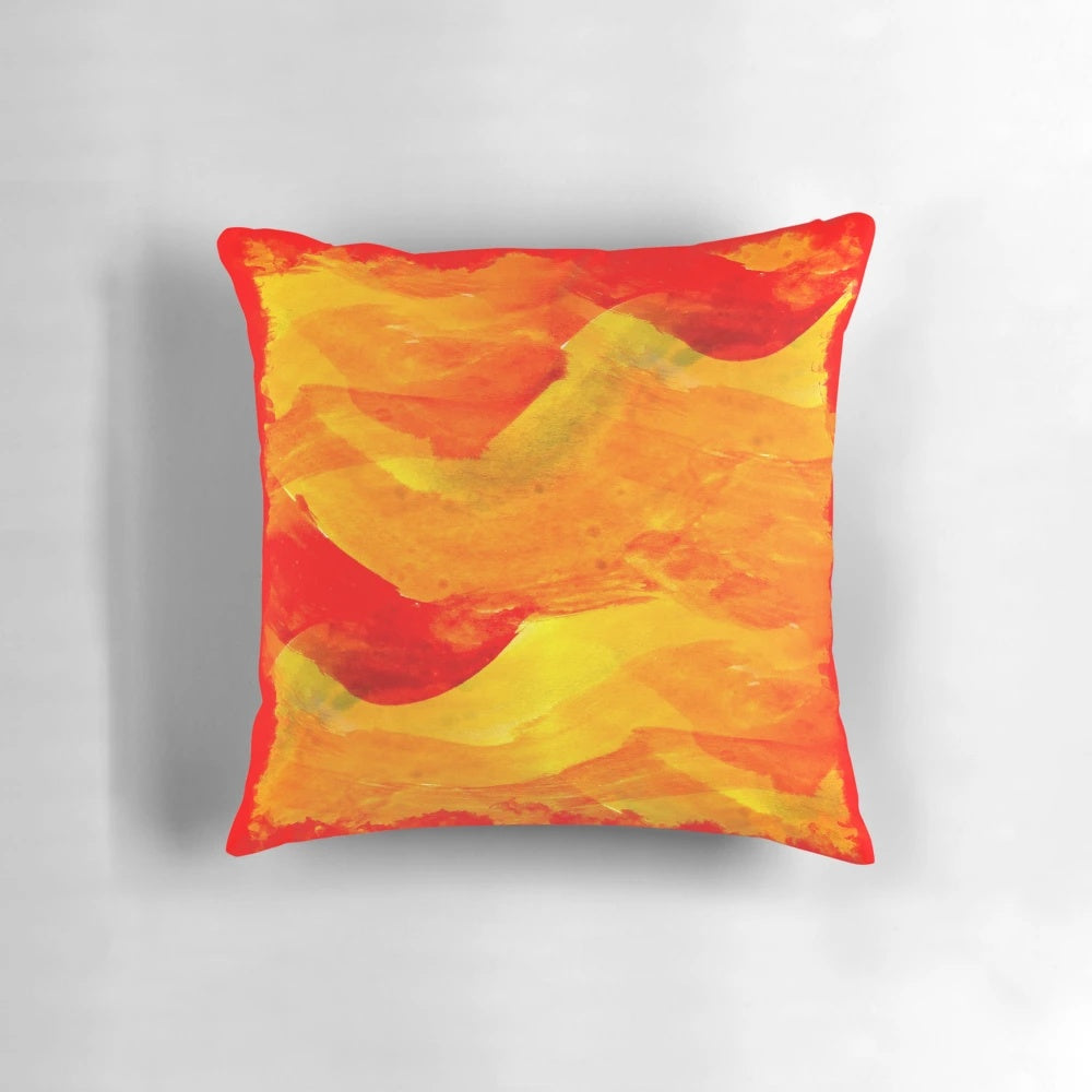 Abstract red and yellow decorative pillow with a wave design, perfect for modern home decor