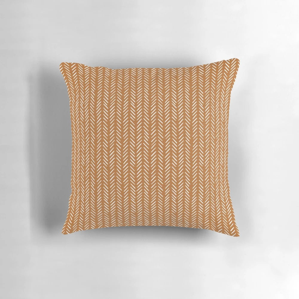 Modern boho chevron orange pillow with a cozy, stylish design for home decor.