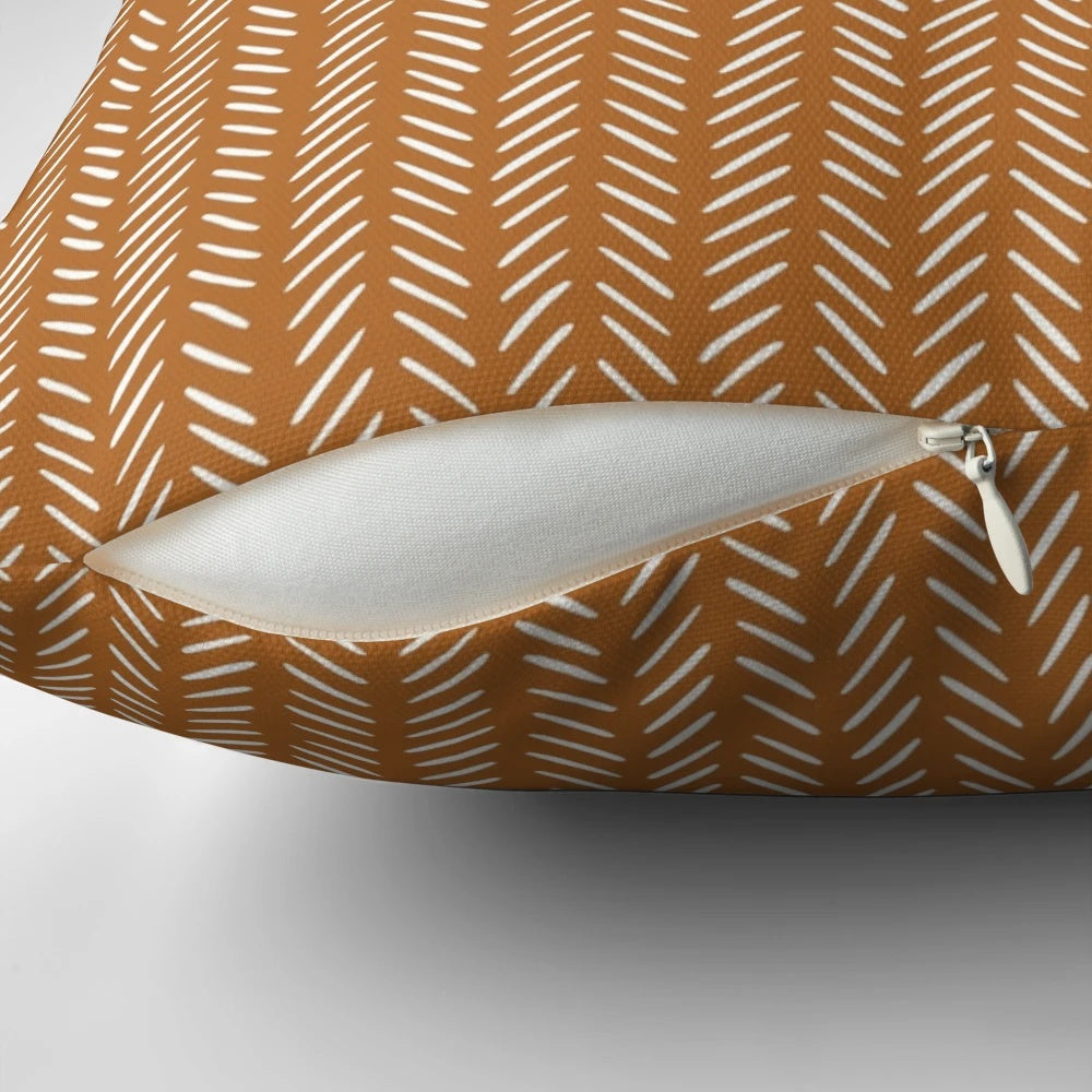 Modern boho chevron orange pillow with a cozy, stylish design for home decor.
