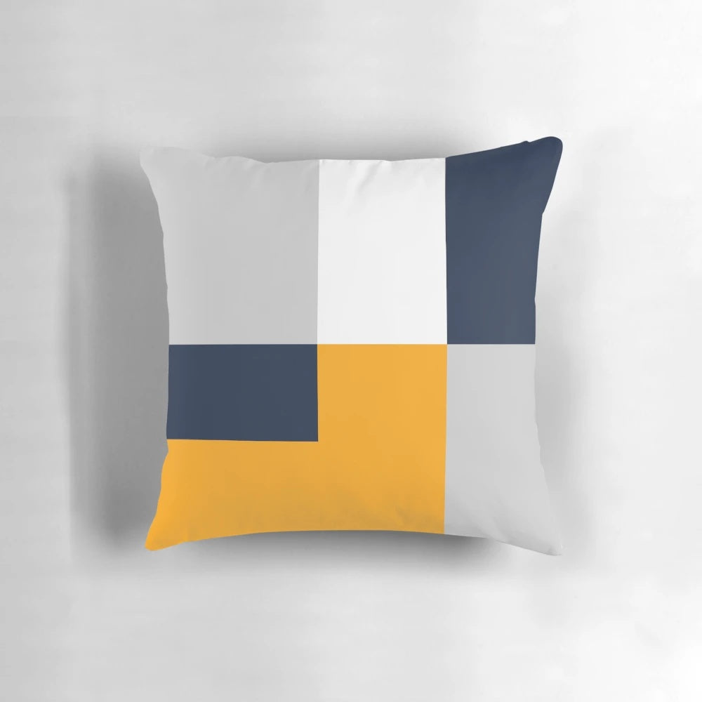 Modern color block throw pillow in navy, grey, and yellow colors