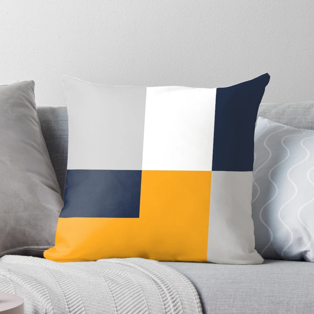 Modern color block throw pillow in navy, grey, and yellow colors