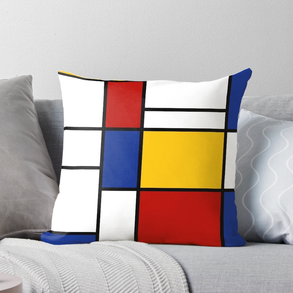 De Stijl-inspired pillow with bold primary color blocks and lines, celebrating Piet Mondrian's iconic abstract art.