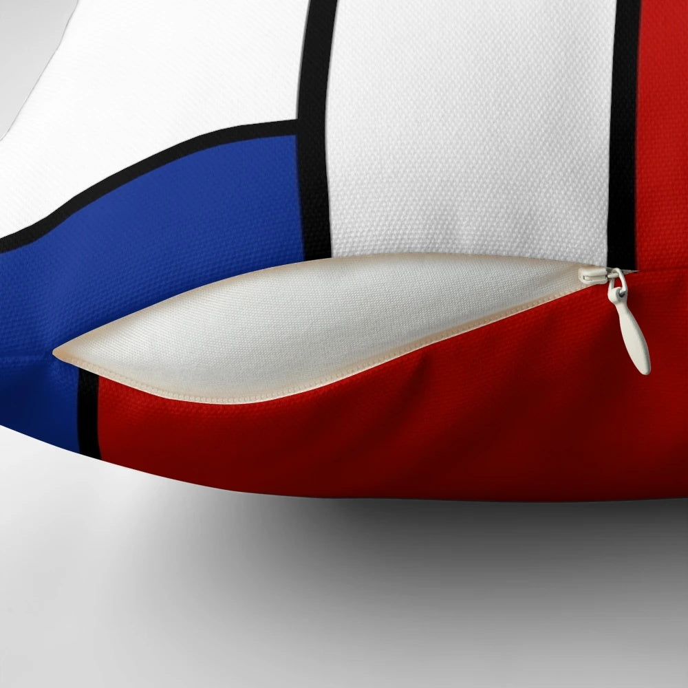 De Stijl-inspired pillow with bold primary color blocks and lines, celebrating Piet Mondrian's iconic abstract art.