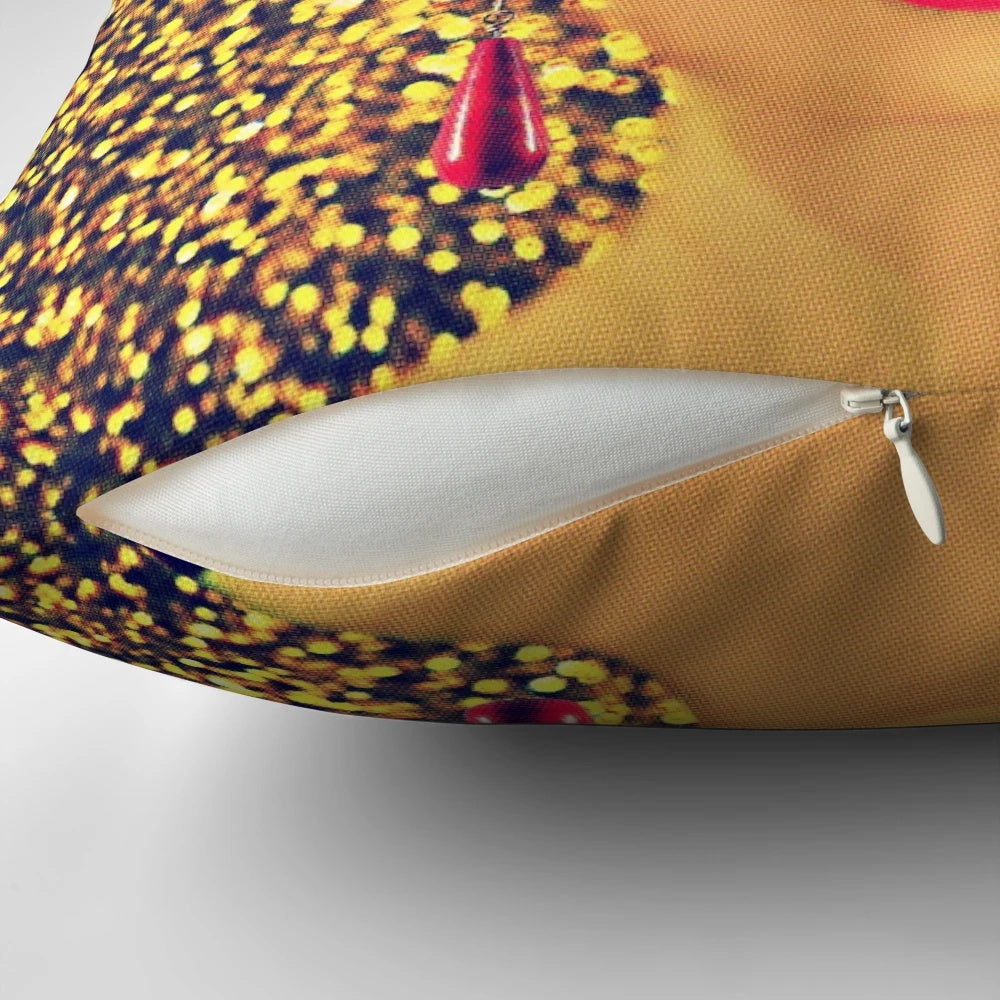 Vibrant gold pillow with a portrait of renowned Mexican artist Frida Kahlo