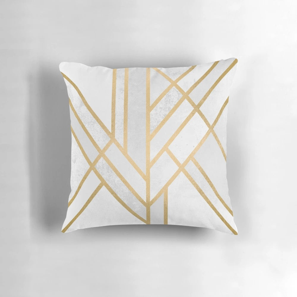 A decorative pillow cover featuring a modern, abstract geometric design in gold and white.